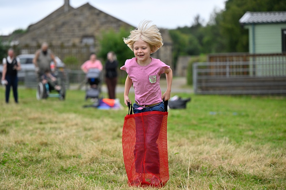 Young girl enjoying summer fun at Leeds Children's Charity